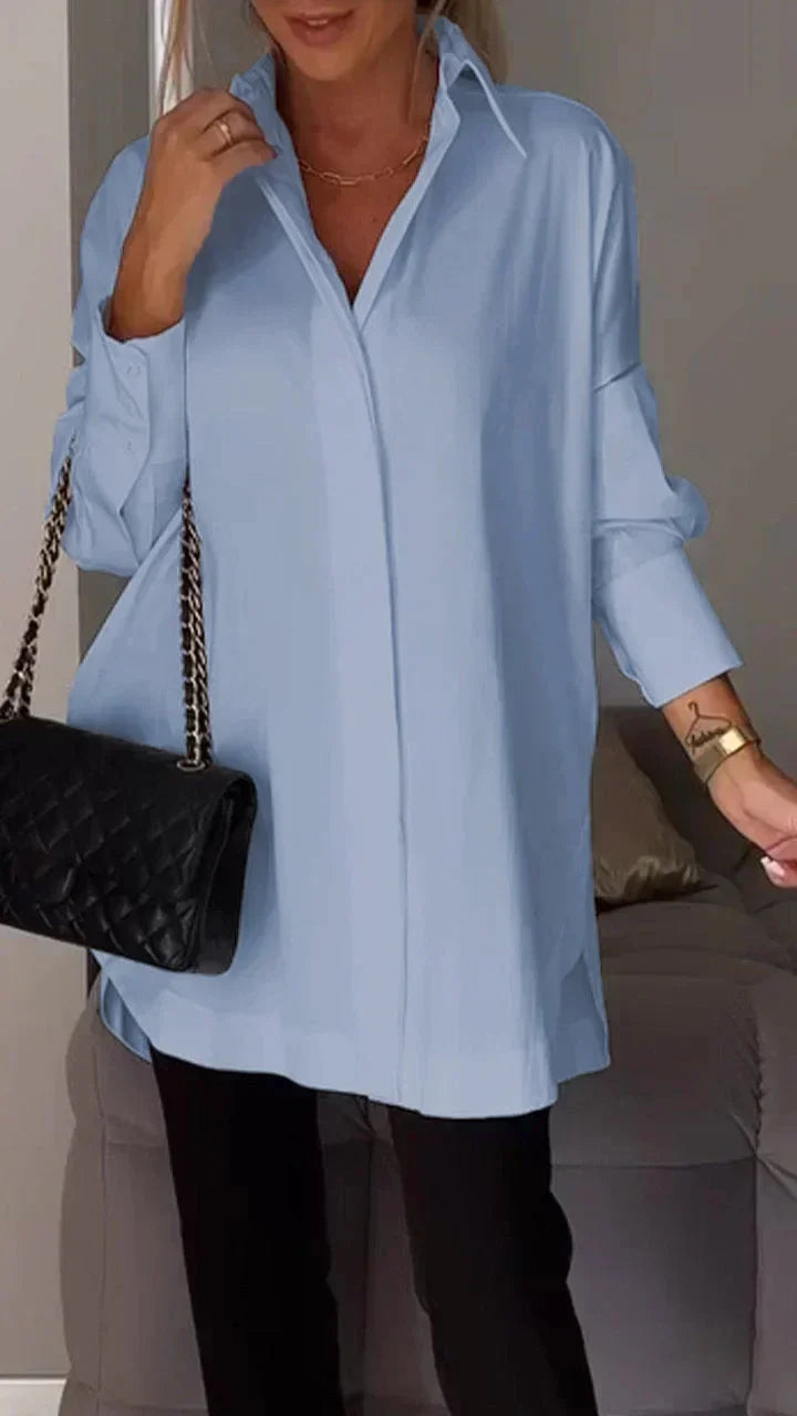 Elegante oversized overhemdblouse met opgerolde mouwen