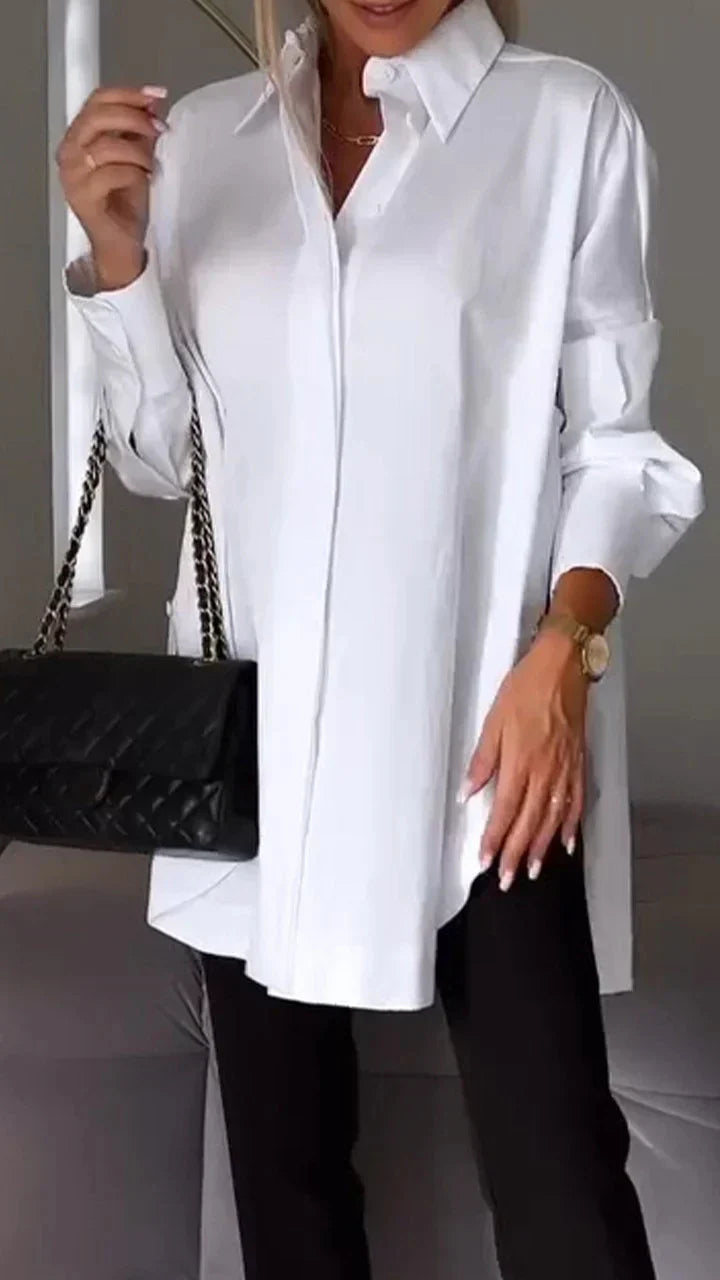 Elegante oversized overhemdblouse met opgerolde mouwen