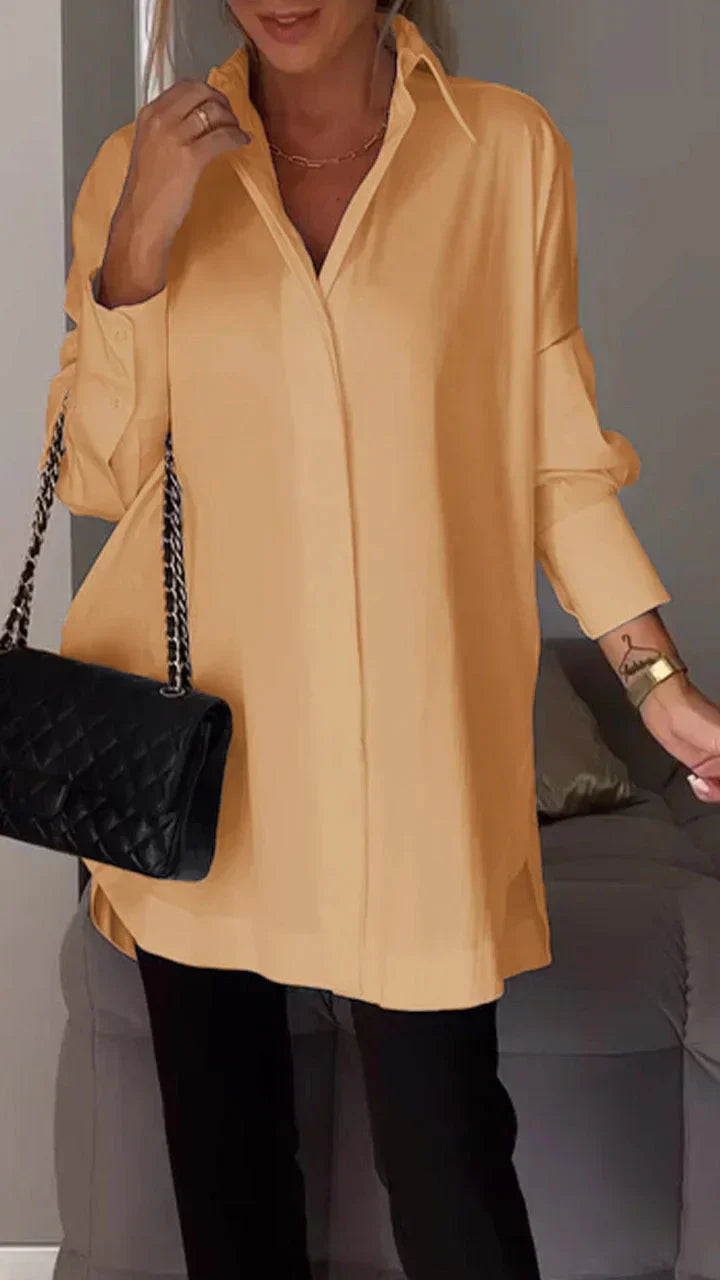 Elegante oversized overhemdblouse met opgerolde mouwen